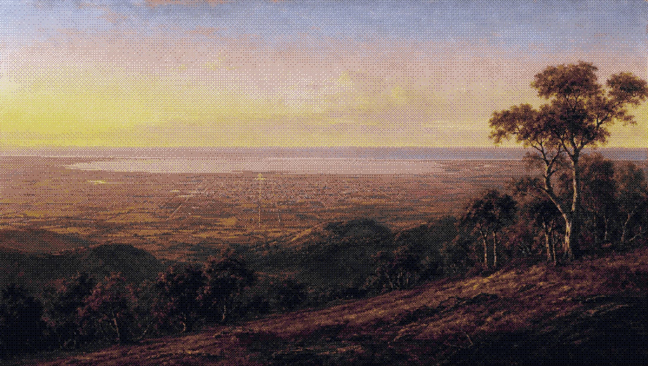 the adelaide hills behind the city in the late afternoon