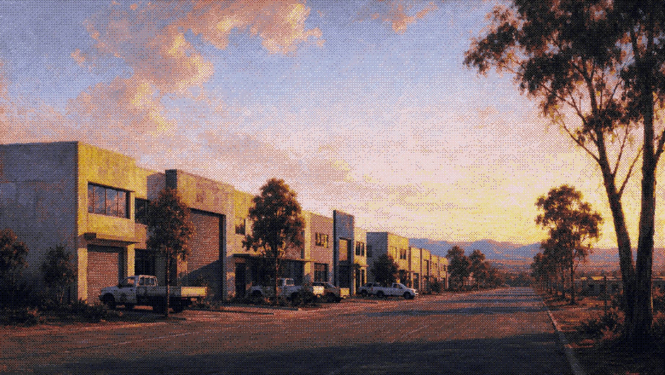 a light-industrial estate on the edge of perth early in the morning, utes parked in marked bays